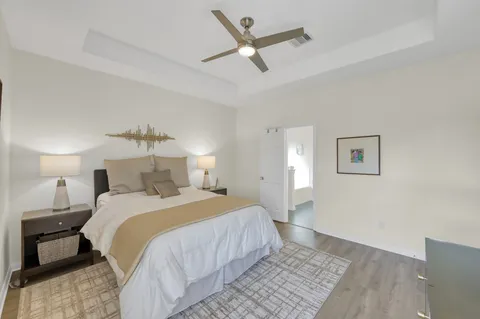a bedroom with a large bed and a window