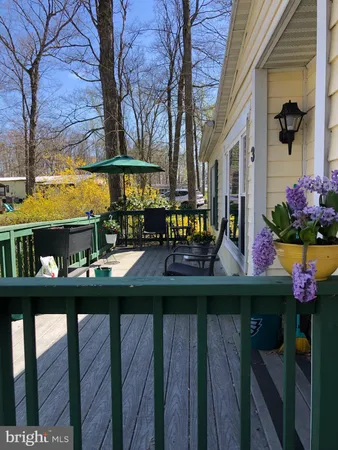 a view of a chairs and table in a patio
