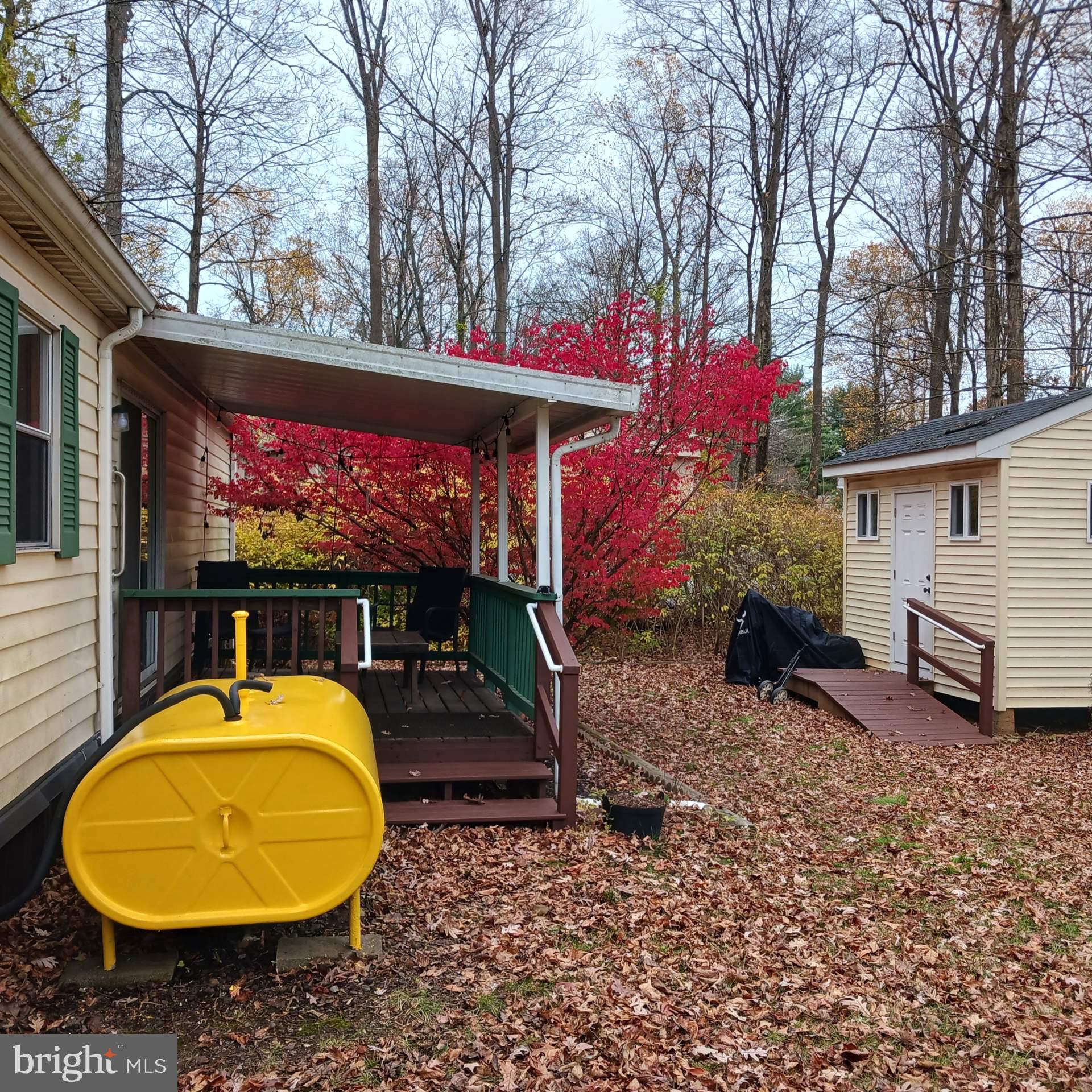 3 Quarry Road Quakertown, PA 18951 - Photo 2 of 16 a view of a swimming pool with a table and chairs