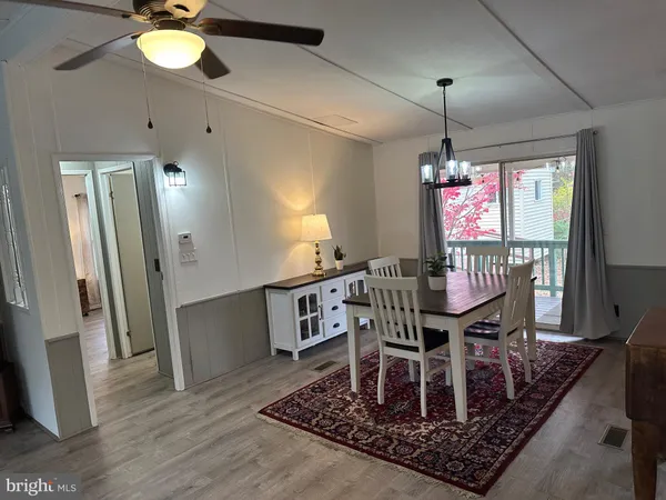 a dining room with furniture and window