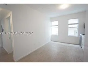 a view of an empty room with a window