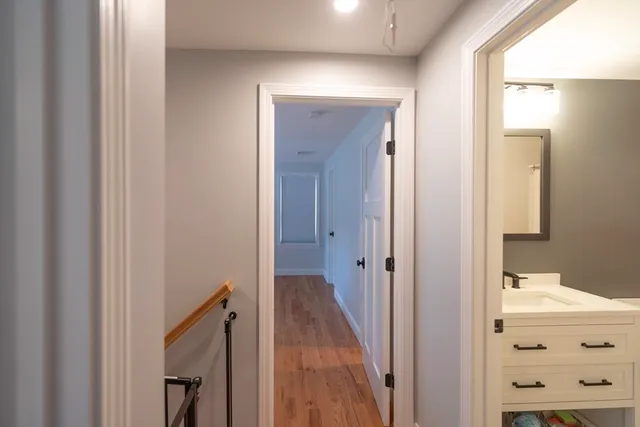 a view of a bathroom from a hallway