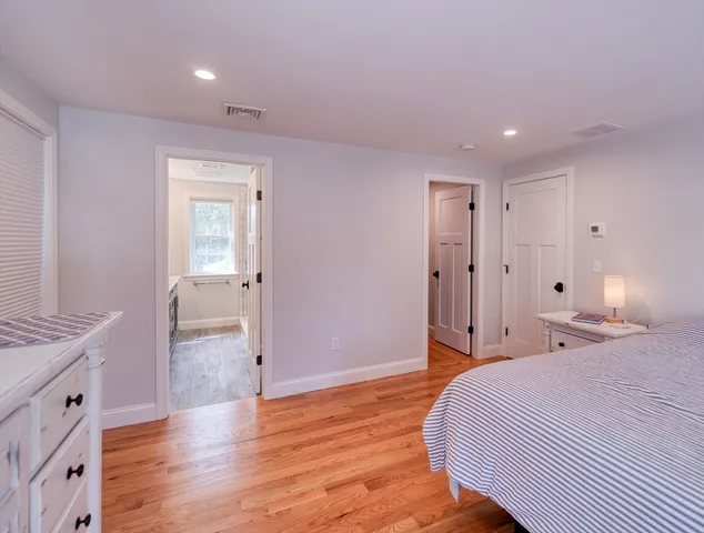 a bedroom with a bed and a table