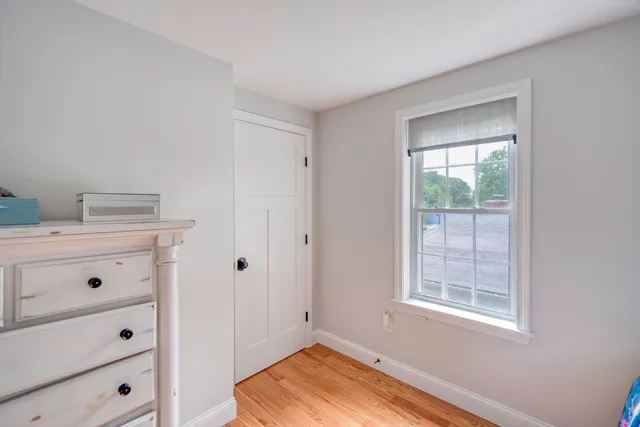 a view of a dresser with wooden floor