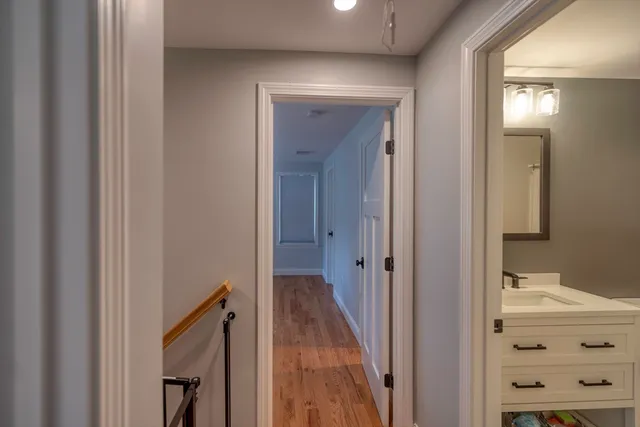 a view of a bathroom from a hallway