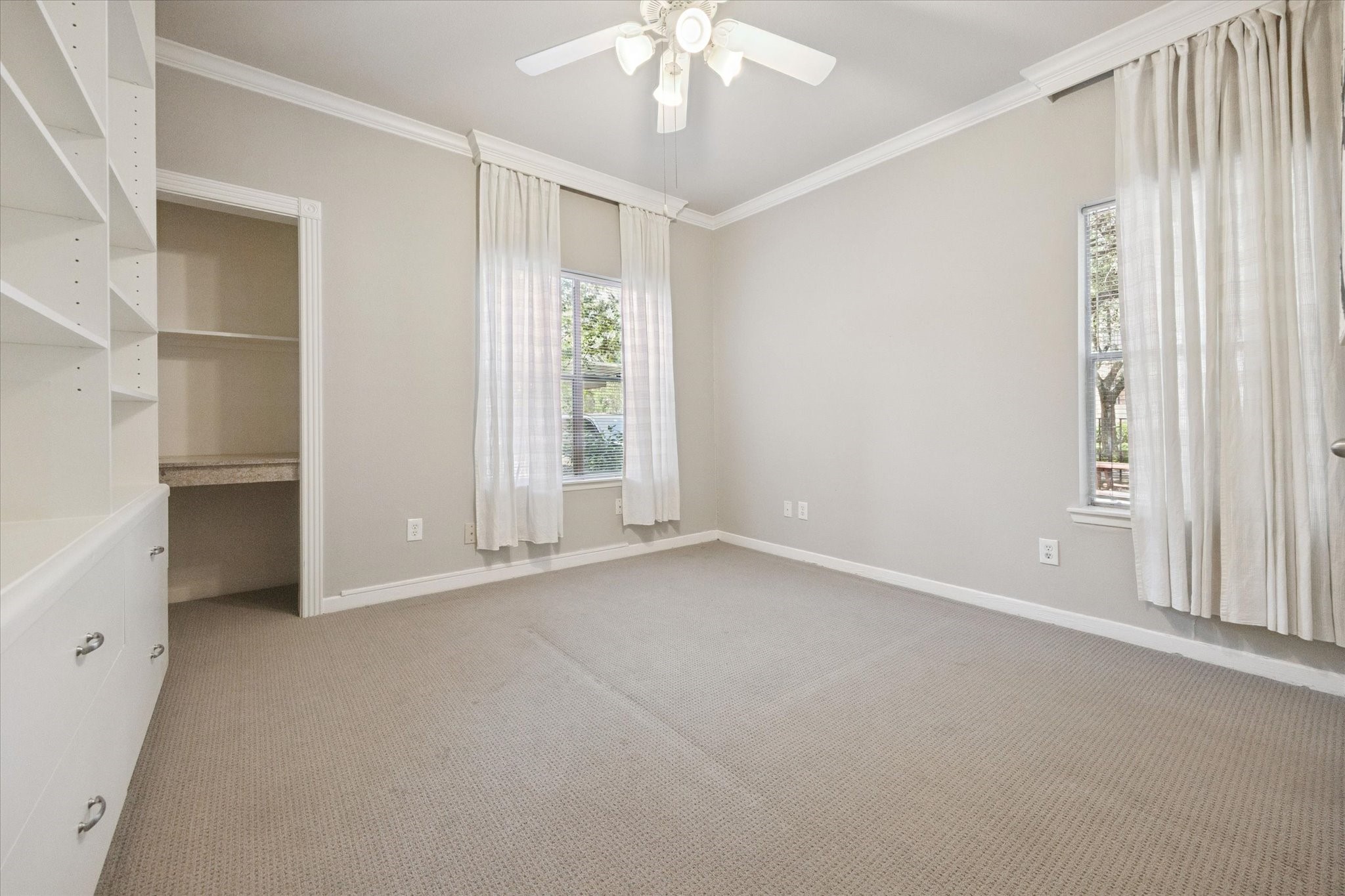 4041 Drake Street, Unit 113 Houston, TX 77005 - Photo 10 of 15 Bedroom with built in shelving / storage and computer nook.