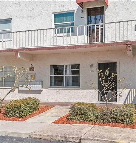 front view of a house with a rug