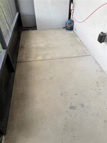 a bathroom with a granite countertop sink and white cabinets