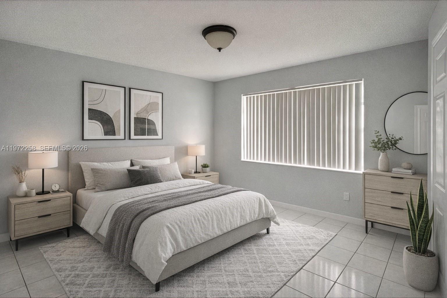 10900 Northwest 7th Street, Unit 101 Miami, FL 33172 - Photo 5 of 10 a bedroom with a bed and a window
