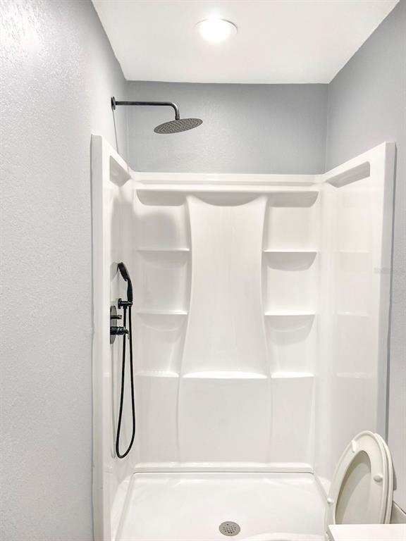 141 South Hiawassee Road Orlando, FL 32835 - Photo 14 of 30 a bathroom with a shower