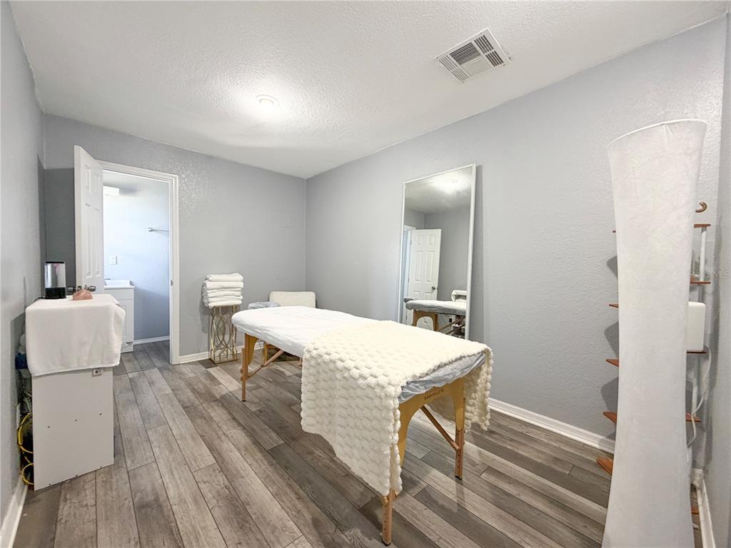 141 South Hiawassee Road Orlando, FL 32835 - Photo 18 of 30 a view of a dining room with furniture and wooden floor