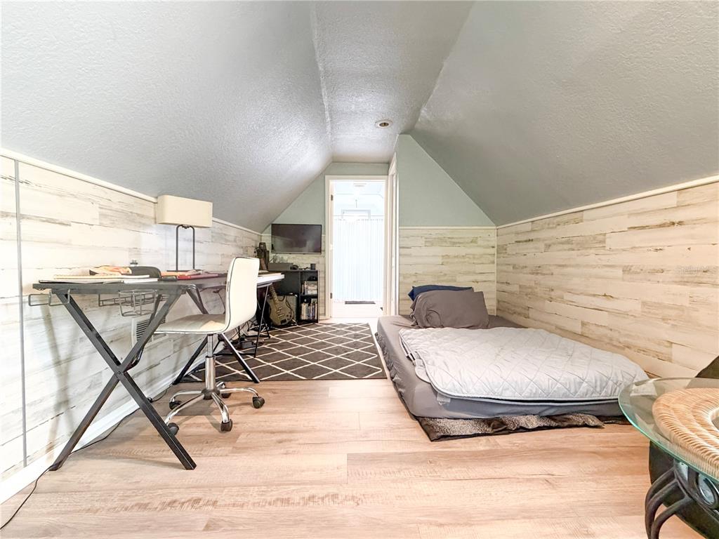 141 South Hiawassee Road Orlando, FL 32835 - Photo 25 of 30 a living room with a couch and a table