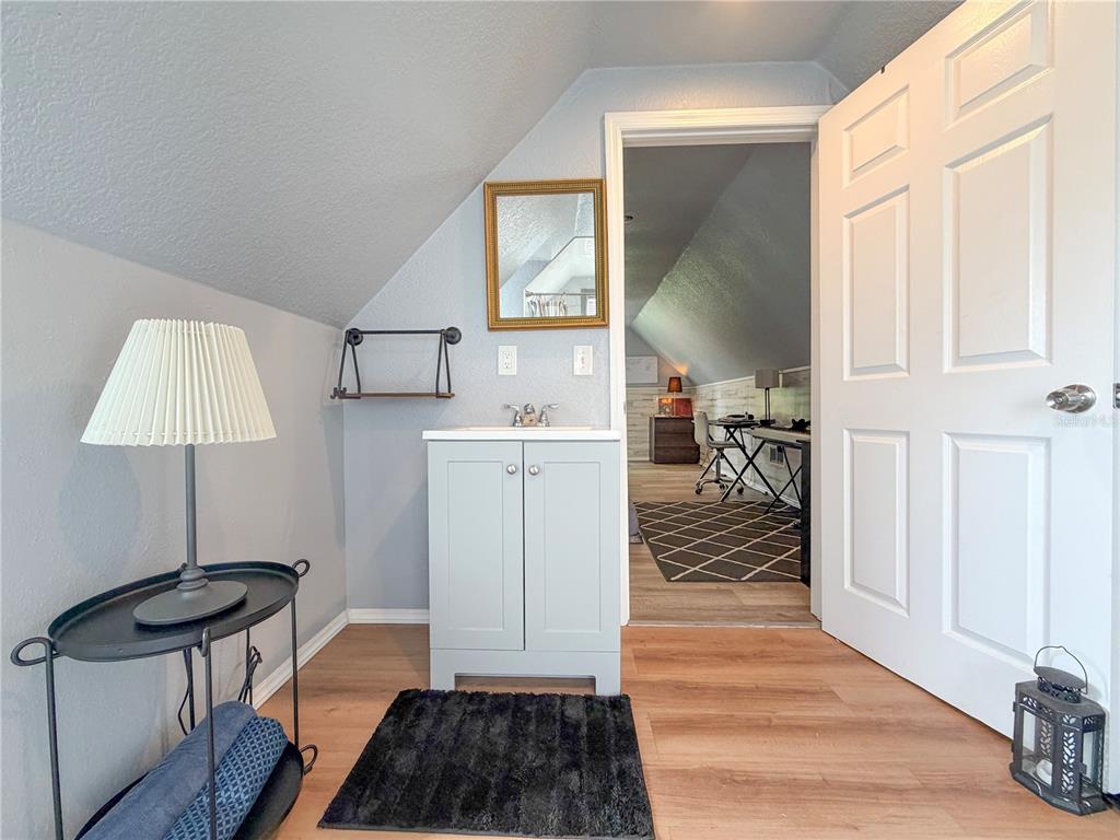 141 South Hiawassee Road Orlando, FL 32835 - Photo 26 of 30 a hallway with a large mirror and a window