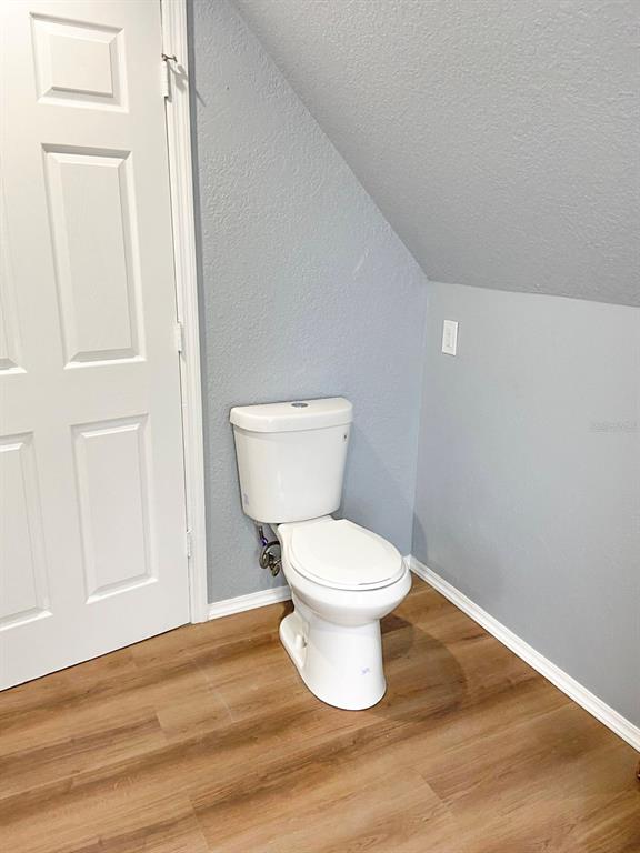 141 South Hiawassee Road Orlando, FL 32835 - Photo 28 of 30 a white toilet sitting next to a bathroom sink