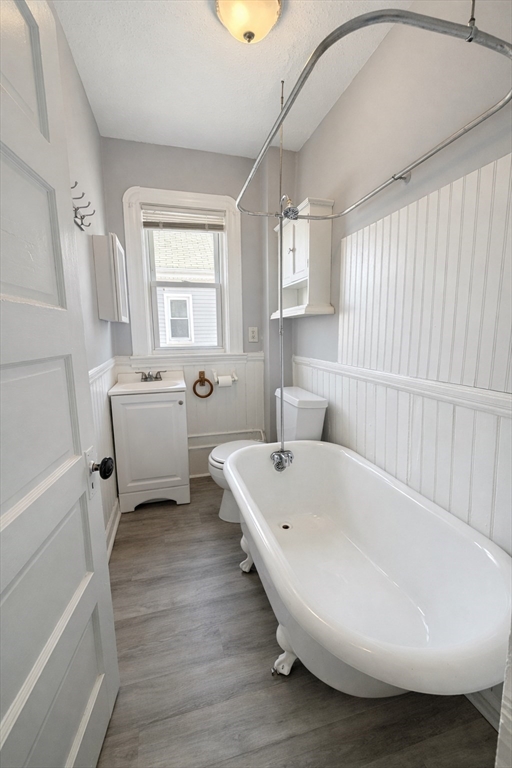 159 Frederick Street, Unit 3E New Bedford, MA 02744 - Photo 8 of 8 a white bath tub sitting next to a white sink