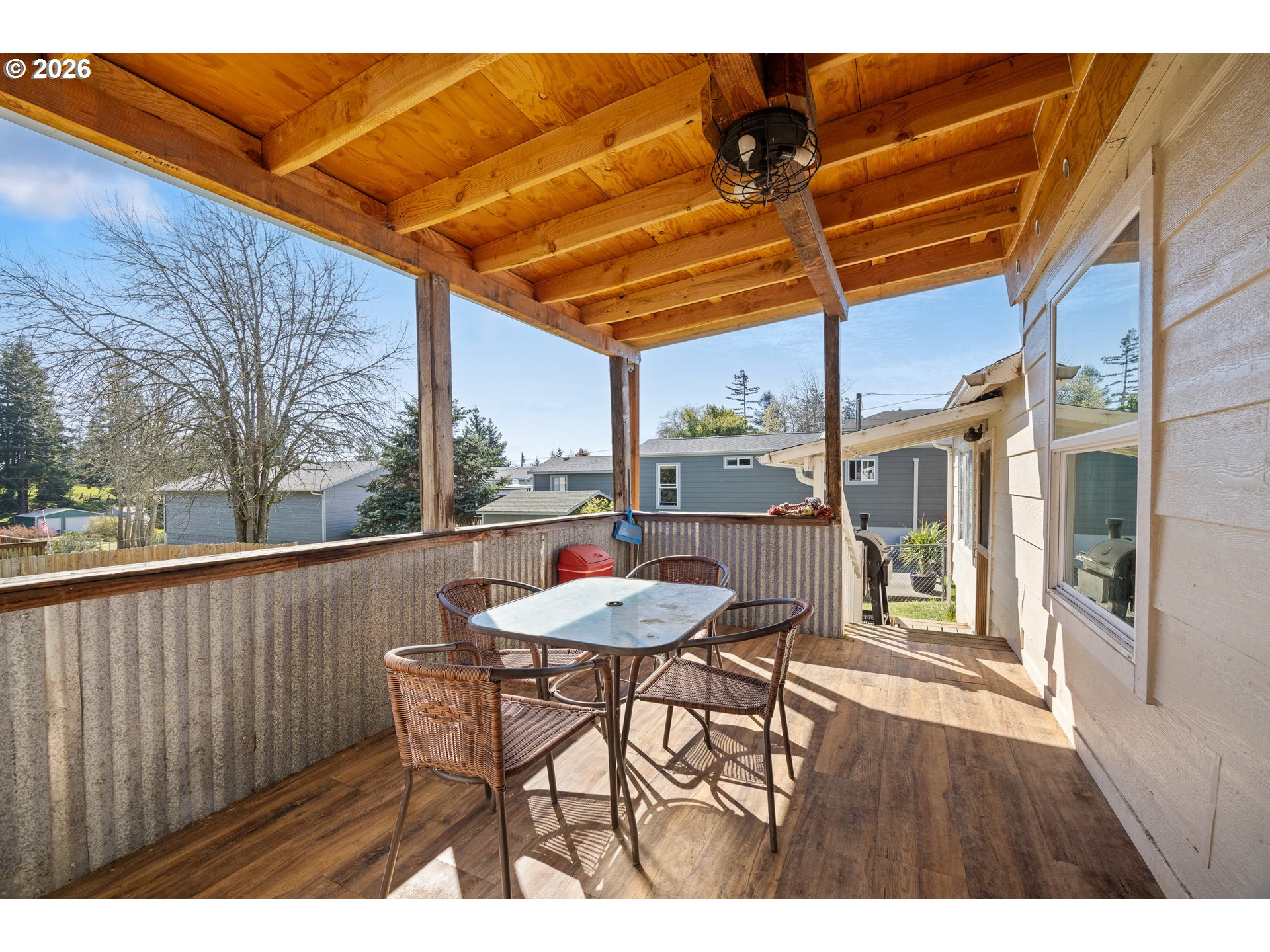 1932 East Willow Street Myrtle Point, OR 97458 - Photo 22 of 28 a view of a chair and tables in the patio