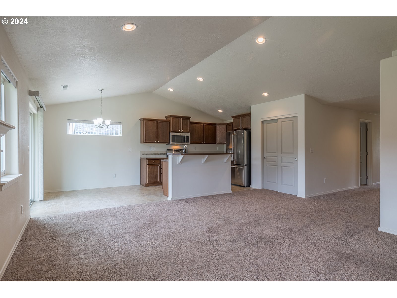 941 South 55th Street Springfield, OR 97478 - Photo 9 of 24 a view of a kitchen with a sink and an oven