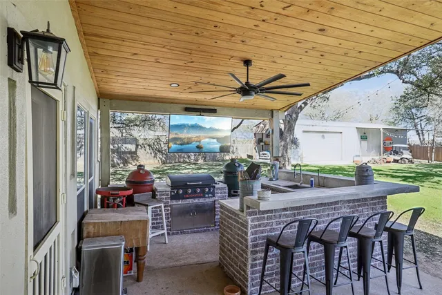 a outdoor space with patio couches and a table and chairs