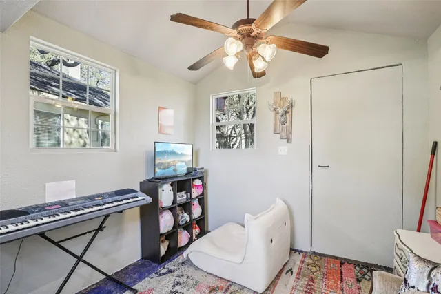 a room with furniture and a flat screen tv