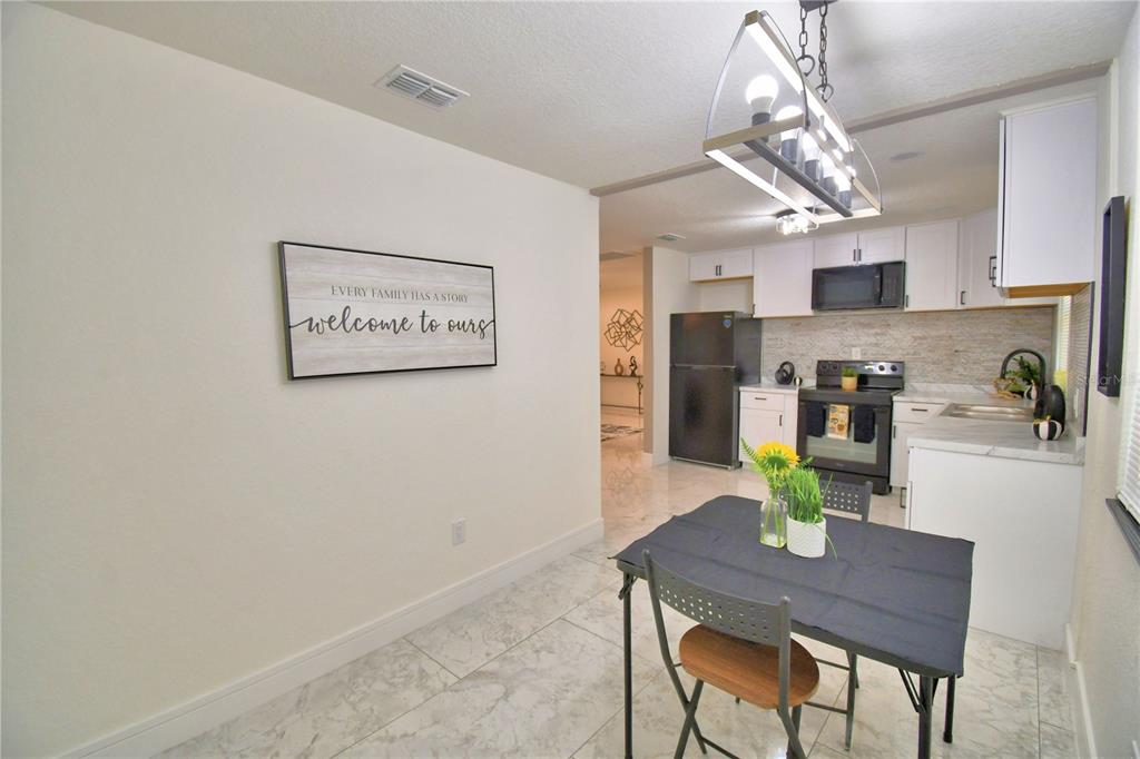 6960 2nd Street Mulberry, FL 33860 - Photo 12 of 39 a view of a dining room with furniture