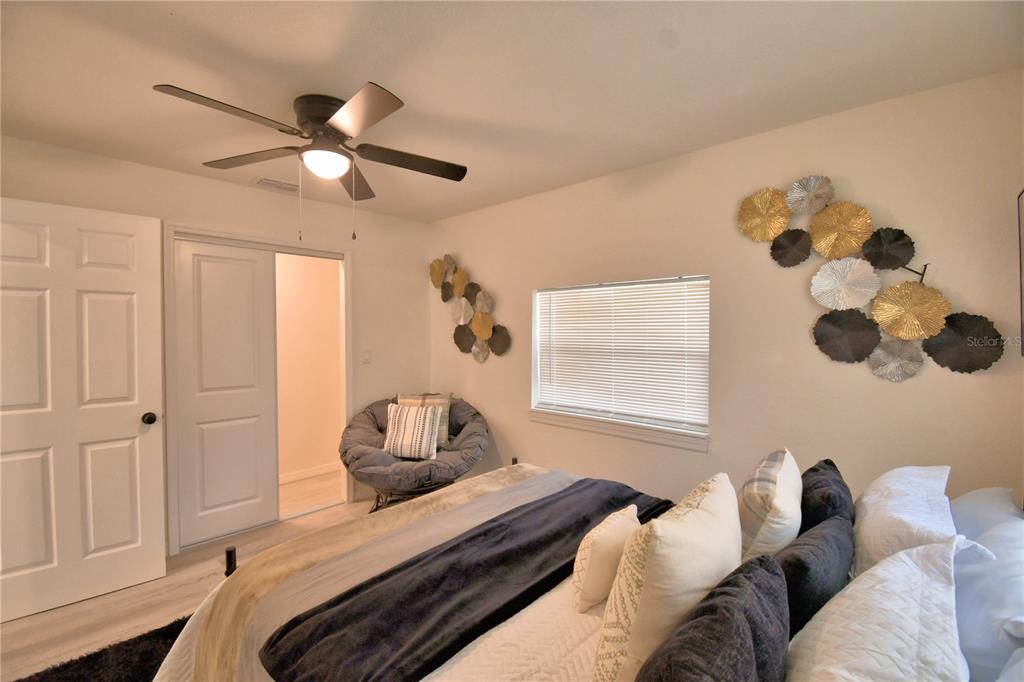 6960 2nd Street Mulberry, FL 33860 - Photo 21 of 39 a bedroom with a bed and a window