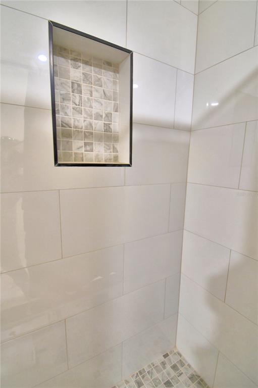 6960 2nd Street Mulberry, FL 33860 - Photo 29 of 39 a bathroom with a shower and a window