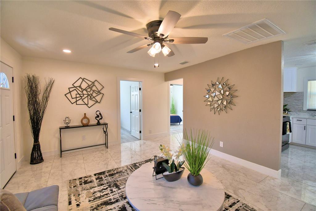 6960 2nd Street Mulberry, FL 33860 - Photo 8 of 39 a living room with furniture and potted plant