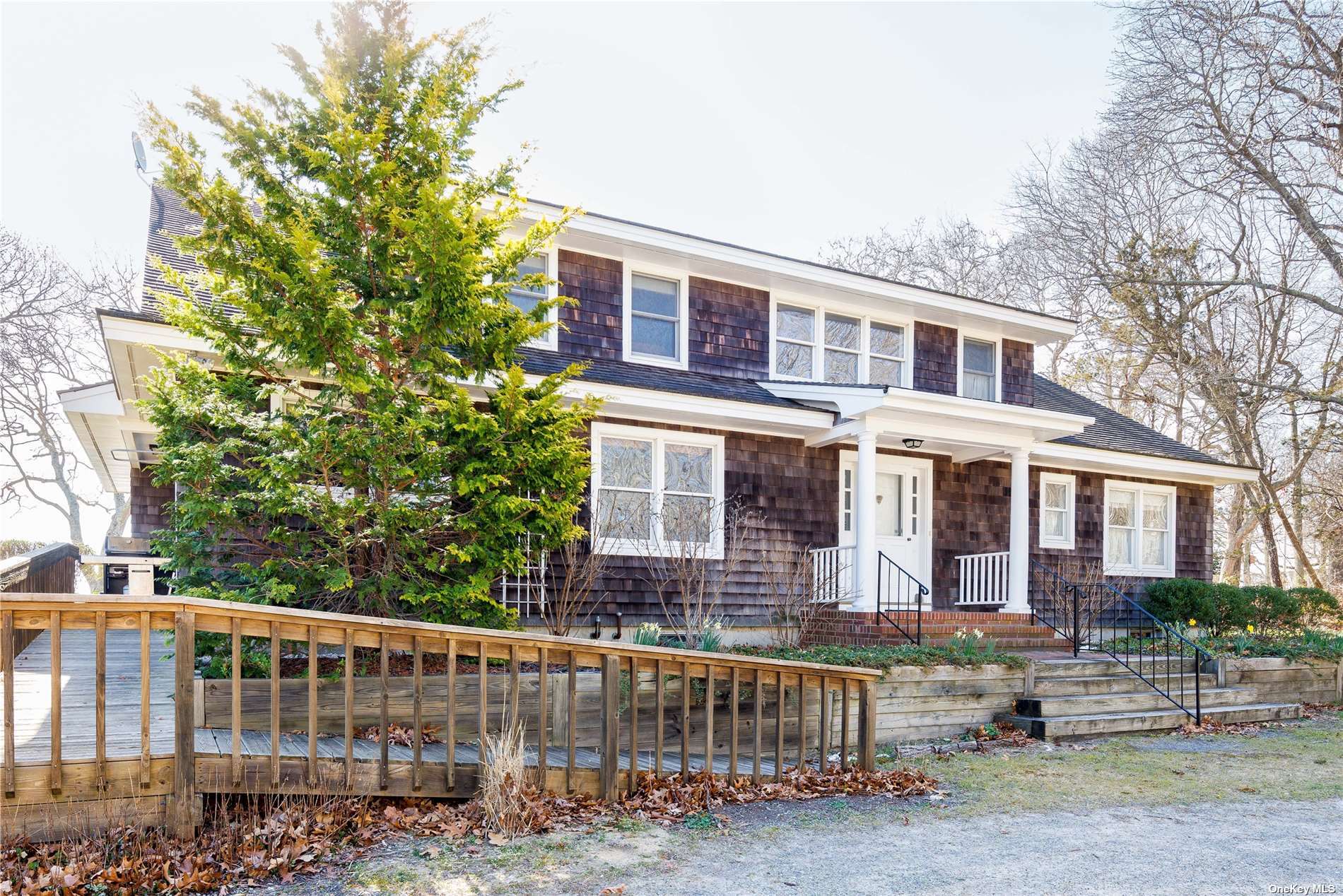 4299 New Suffolk Road New Suffolk, NY 11956 - Photo 1 of 1 a front view of a house with a garden