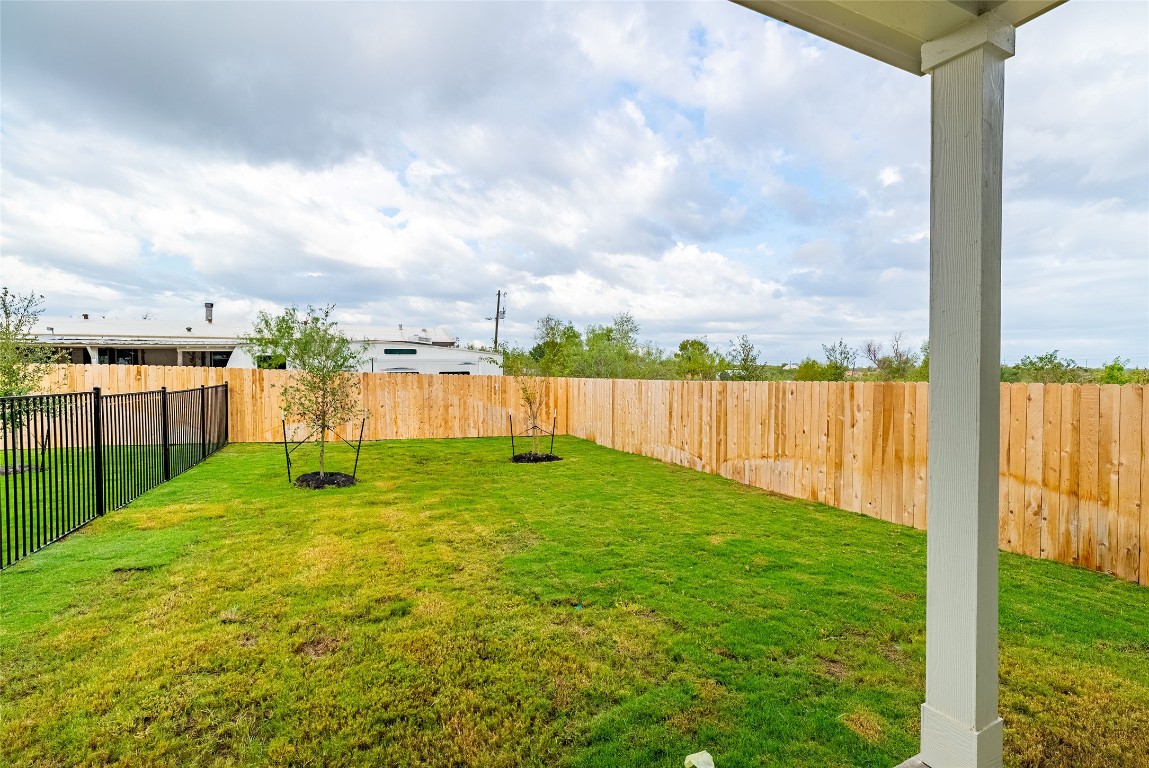 7400 Sparkling Light Drive, Unit A Del Valle, TX 78617 - Photo 20 of 22 View of fenced backyard