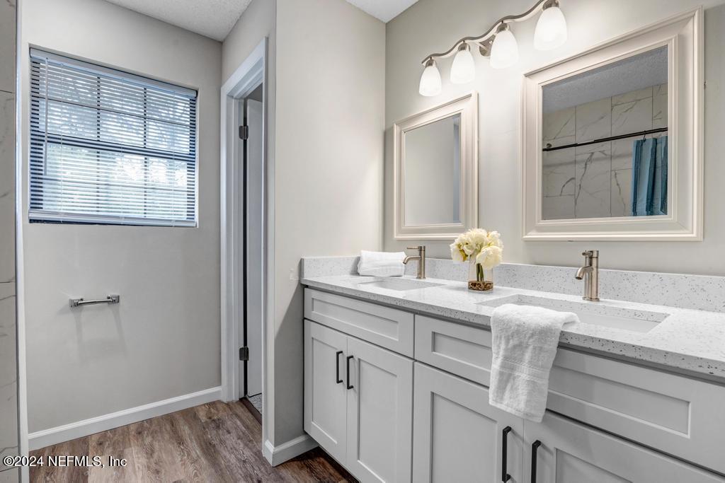 54197 Jeannie Road Callahan, FL 32011 - Photo 23 of 36 a bathroom with a sink and a mirror