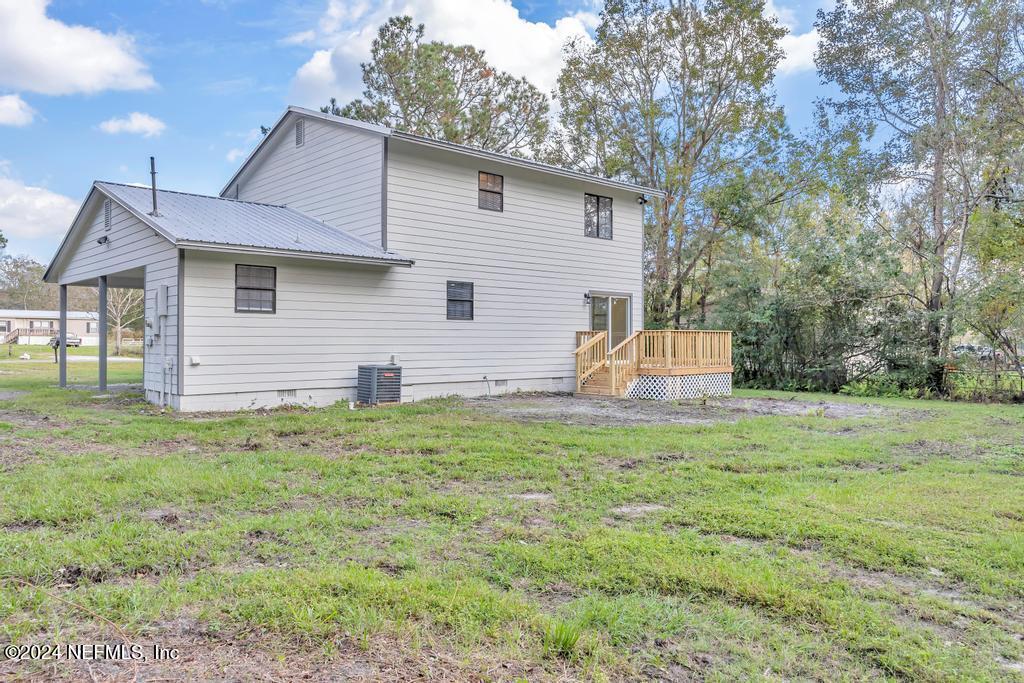 54197 Jeannie Road Callahan, FL 32011 - Photo 34 of 36 a front view of a house with a yard