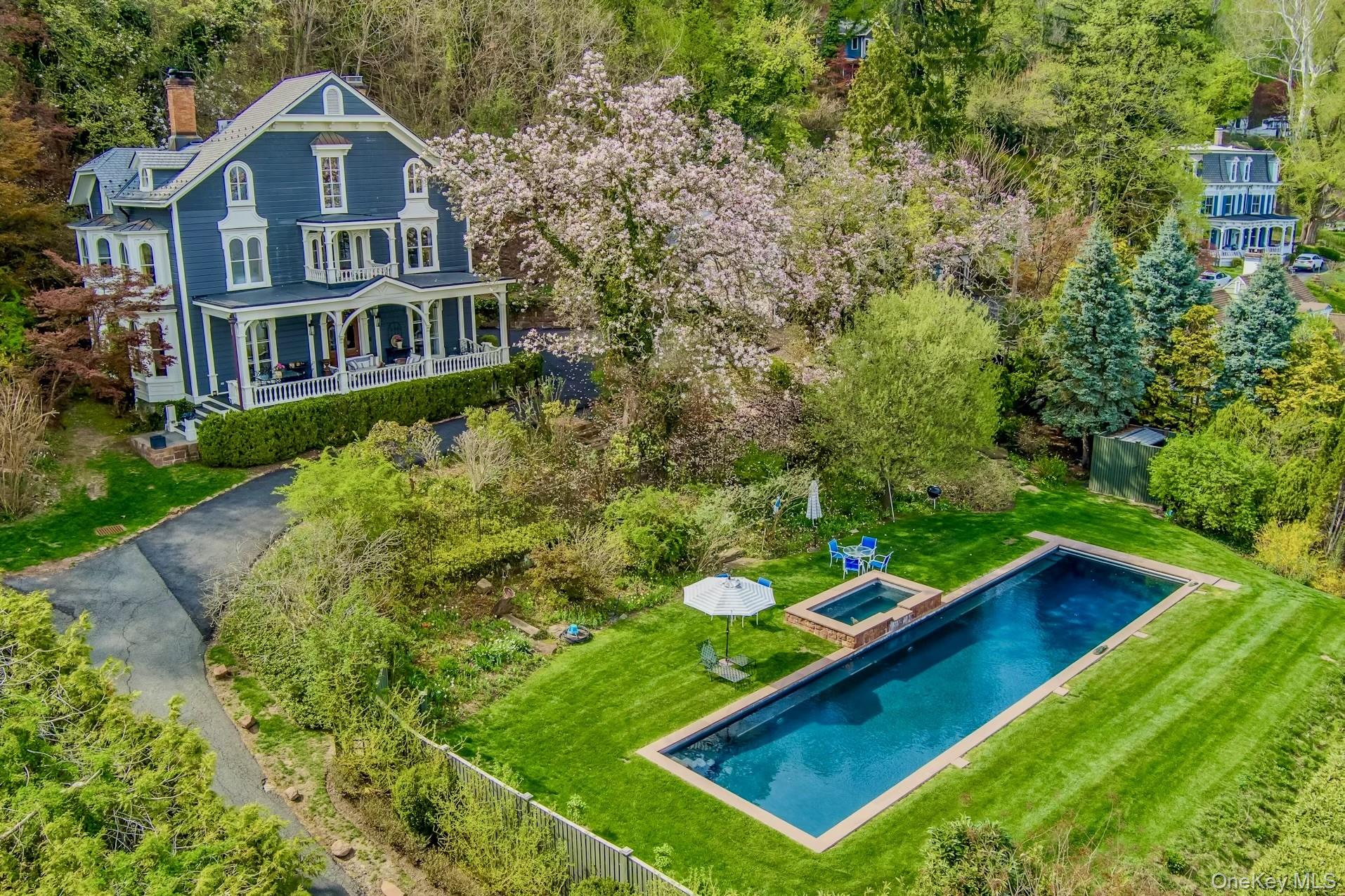 216-217 River Road Nyack, NY 10960 - Photo 11 of 50 an aerial view of a house with swimming pool
