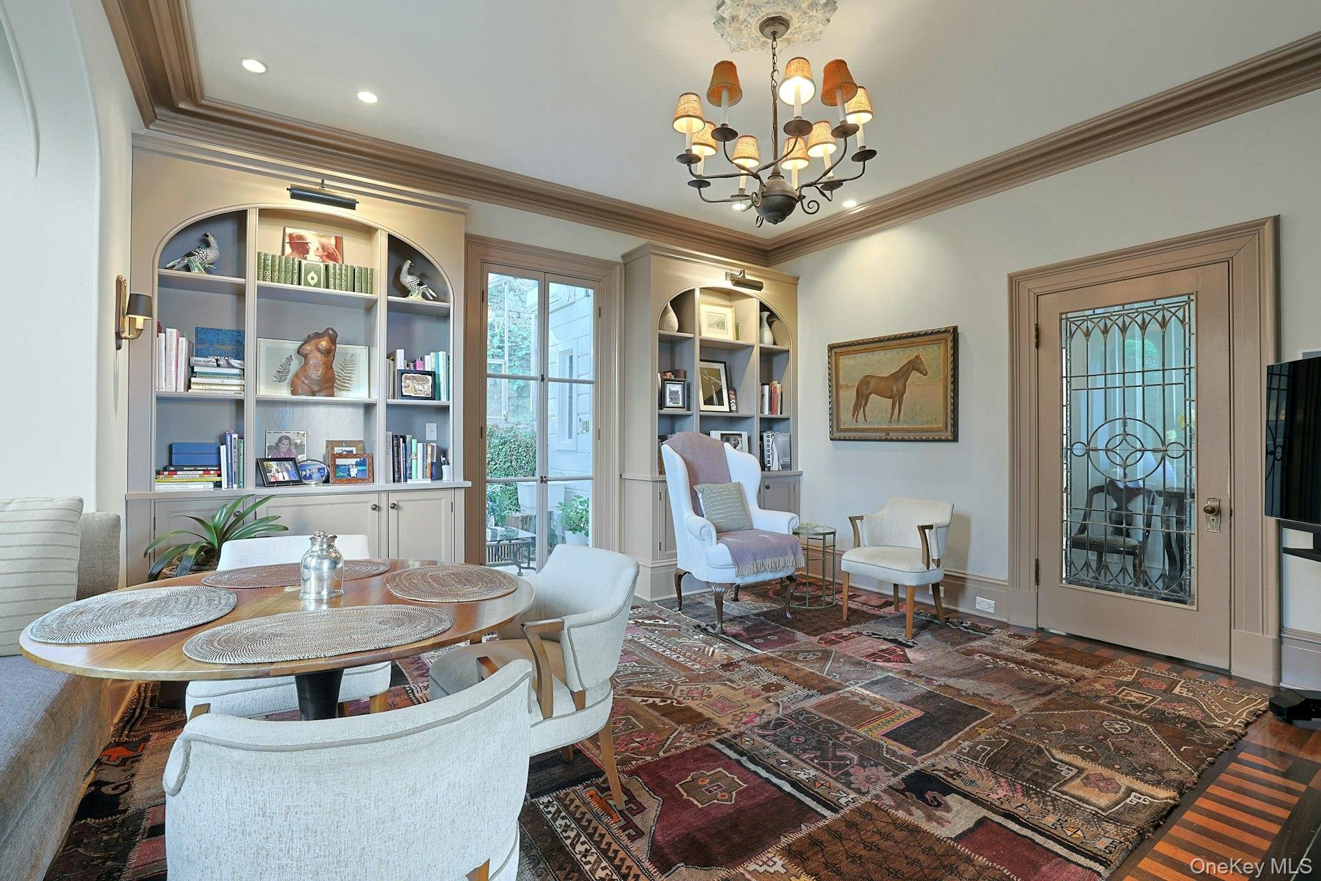 216-217 River Road Nyack, NY 10960 - Photo 25 of 50 a living room with furniture a chandelier and a dining table