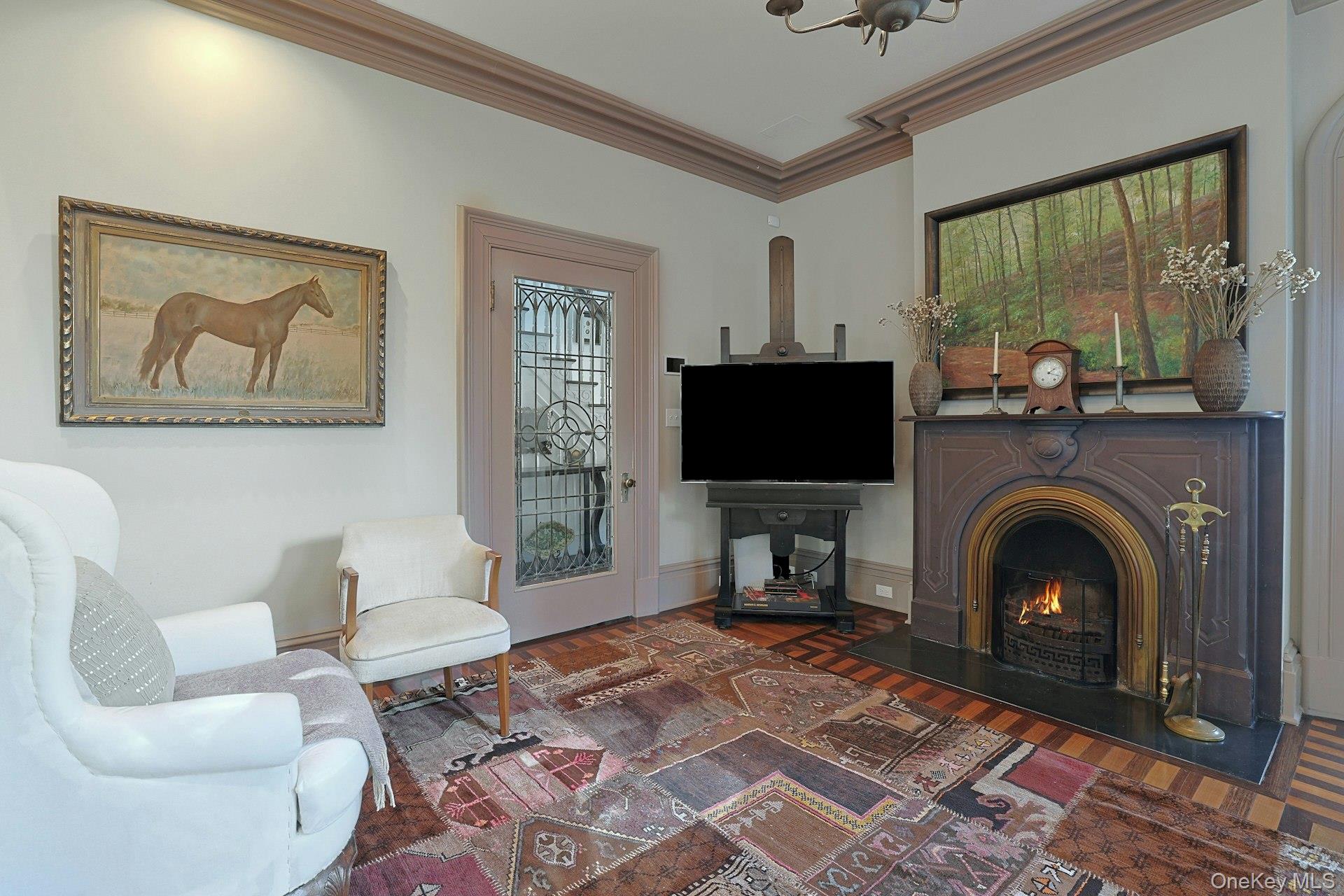 216-217 River Road Nyack, NY 10960 - Photo 31 of 50 a living room with furniture a flat screen tv and a fireplace