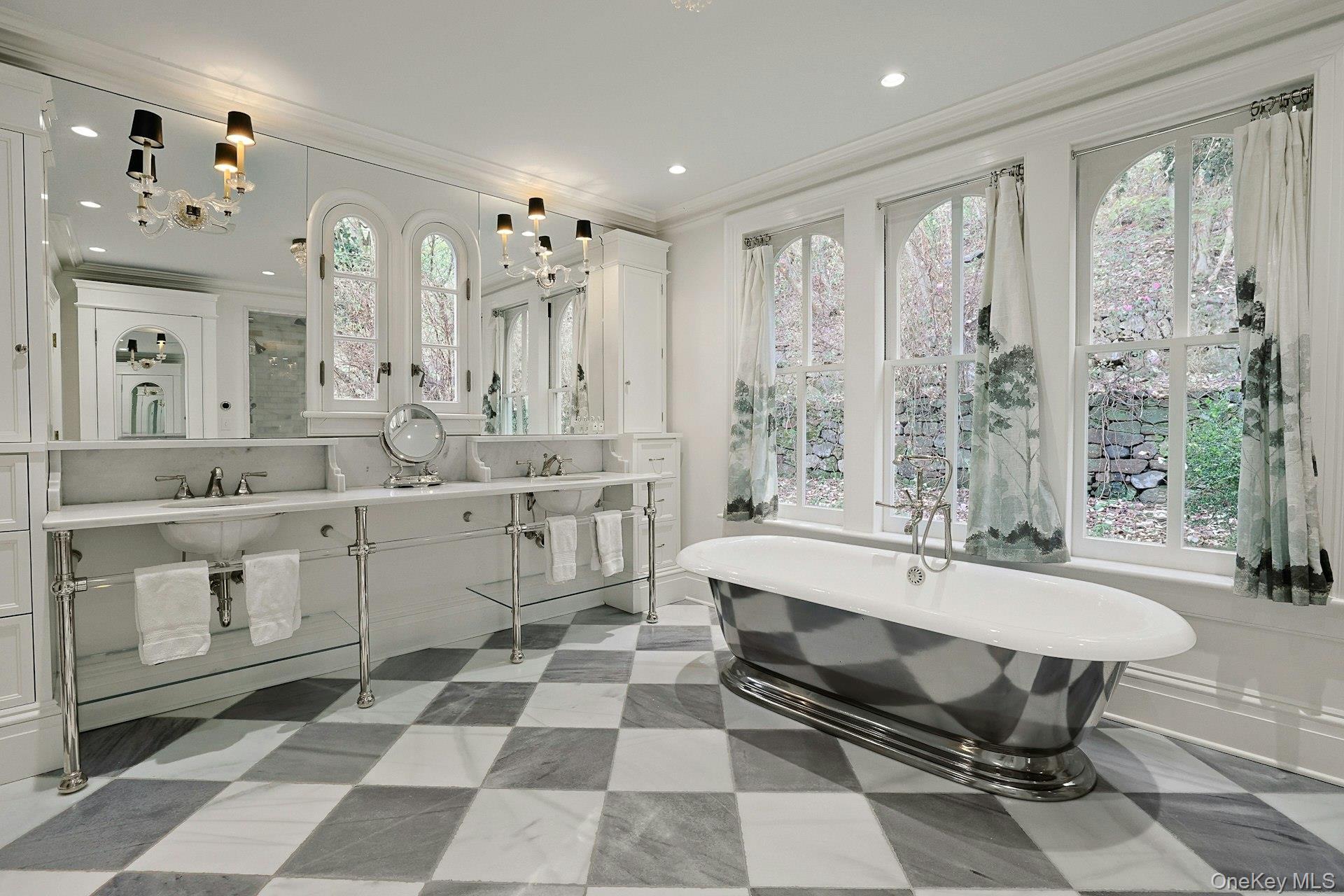 216-217 River Road Nyack, NY 10960 - Photo 35 of 50 a large white bathroom with a double vanity sink a mirror and a bathtub