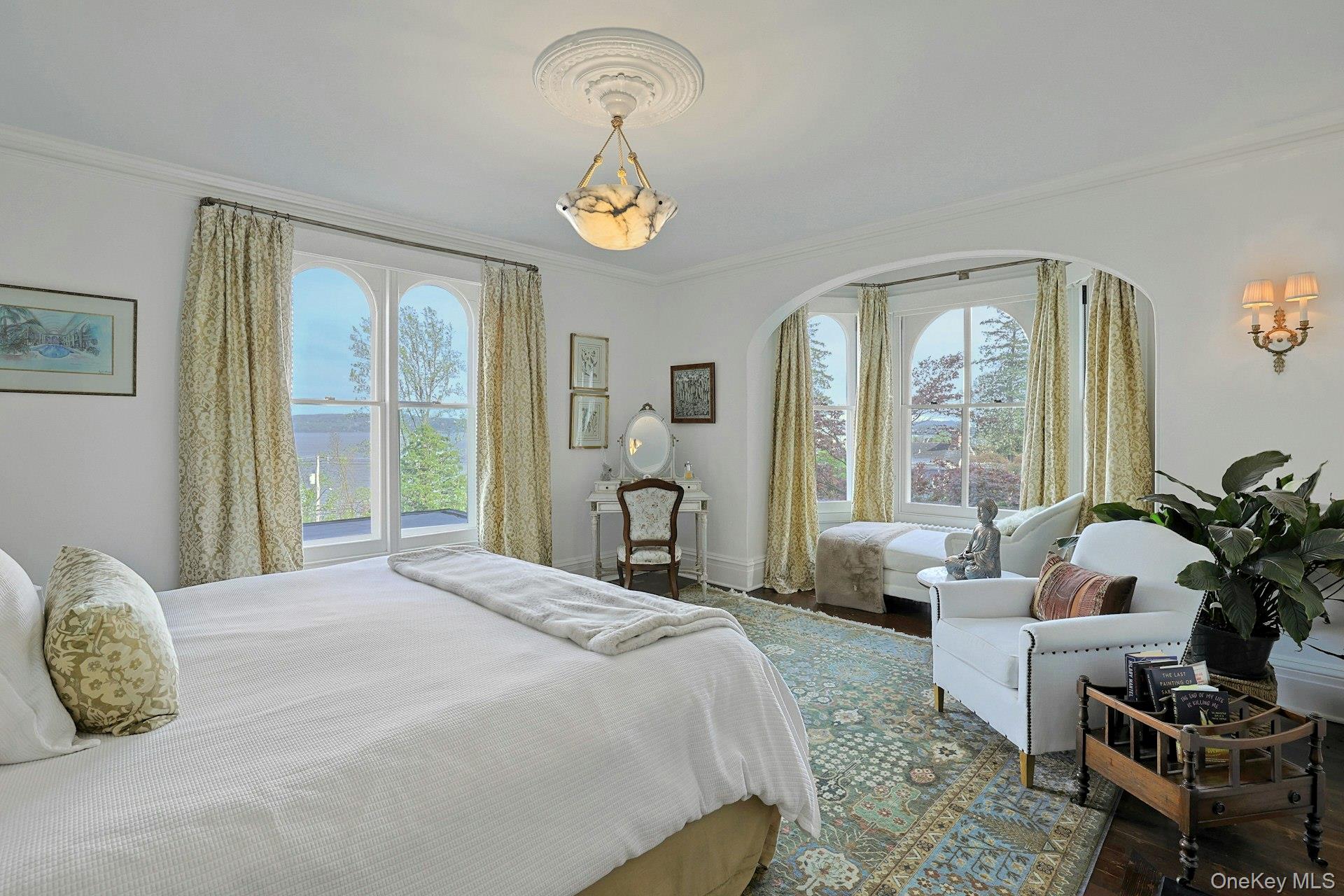 216-217 River Road Nyack, NY 10960 - Photo 36 of 50 a bedroom with a bed and a chandelier