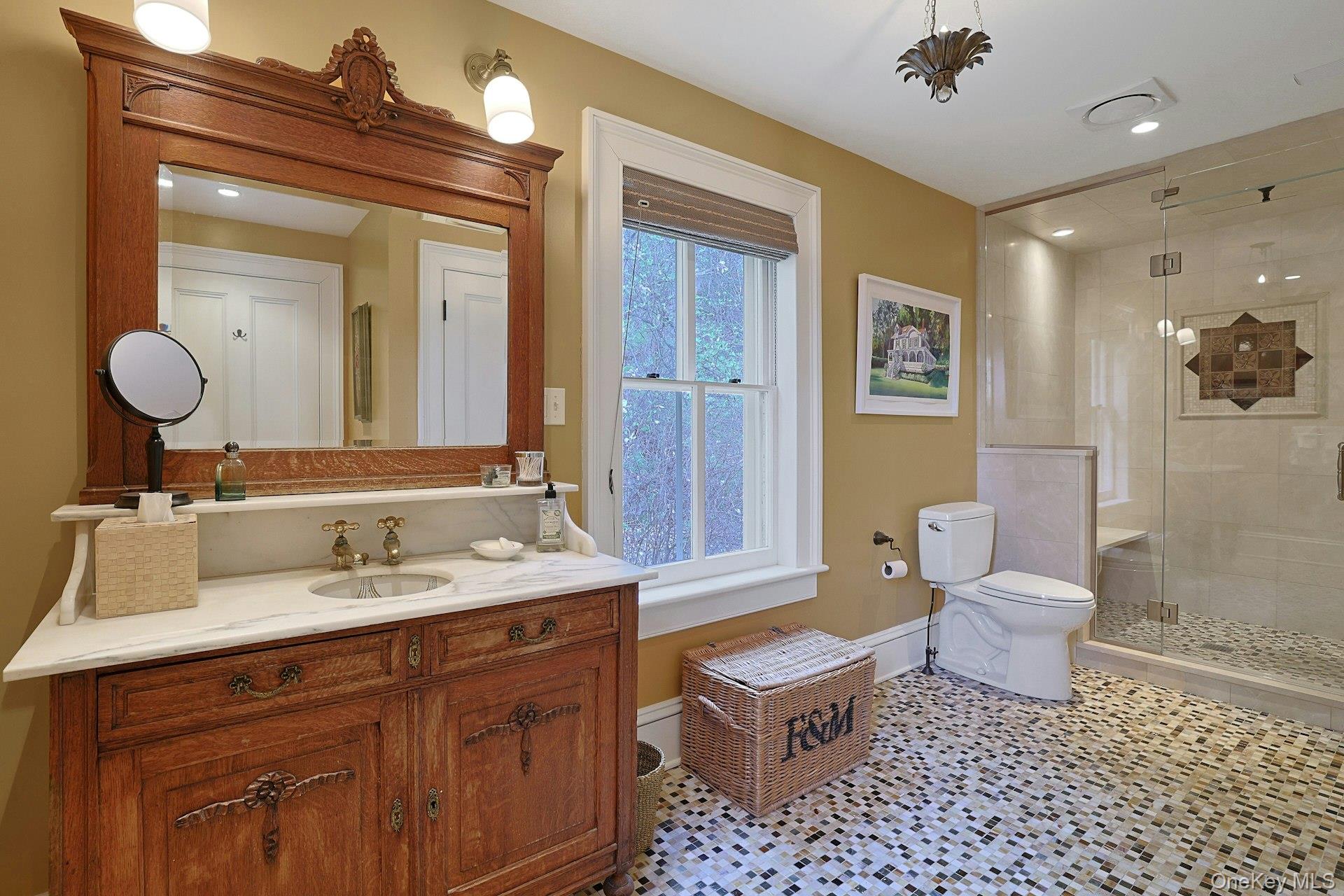 216-217 River Road Nyack, NY 10960 - Photo 48 of 50 a bathroom with a toilet a sink a mirror and a shower