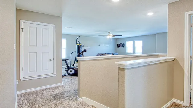 a living room with furniture and a sink