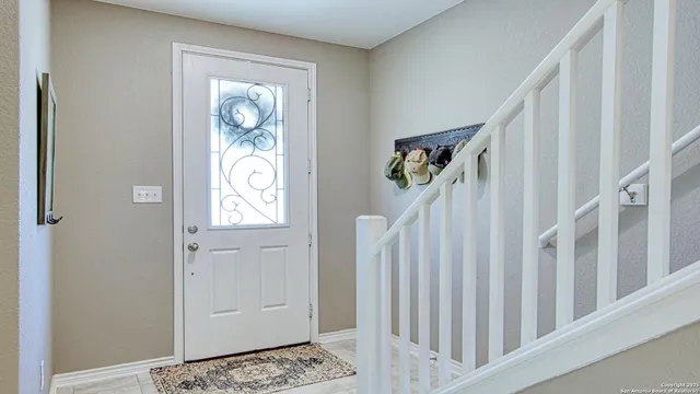 a view of an entryway with wooden floor