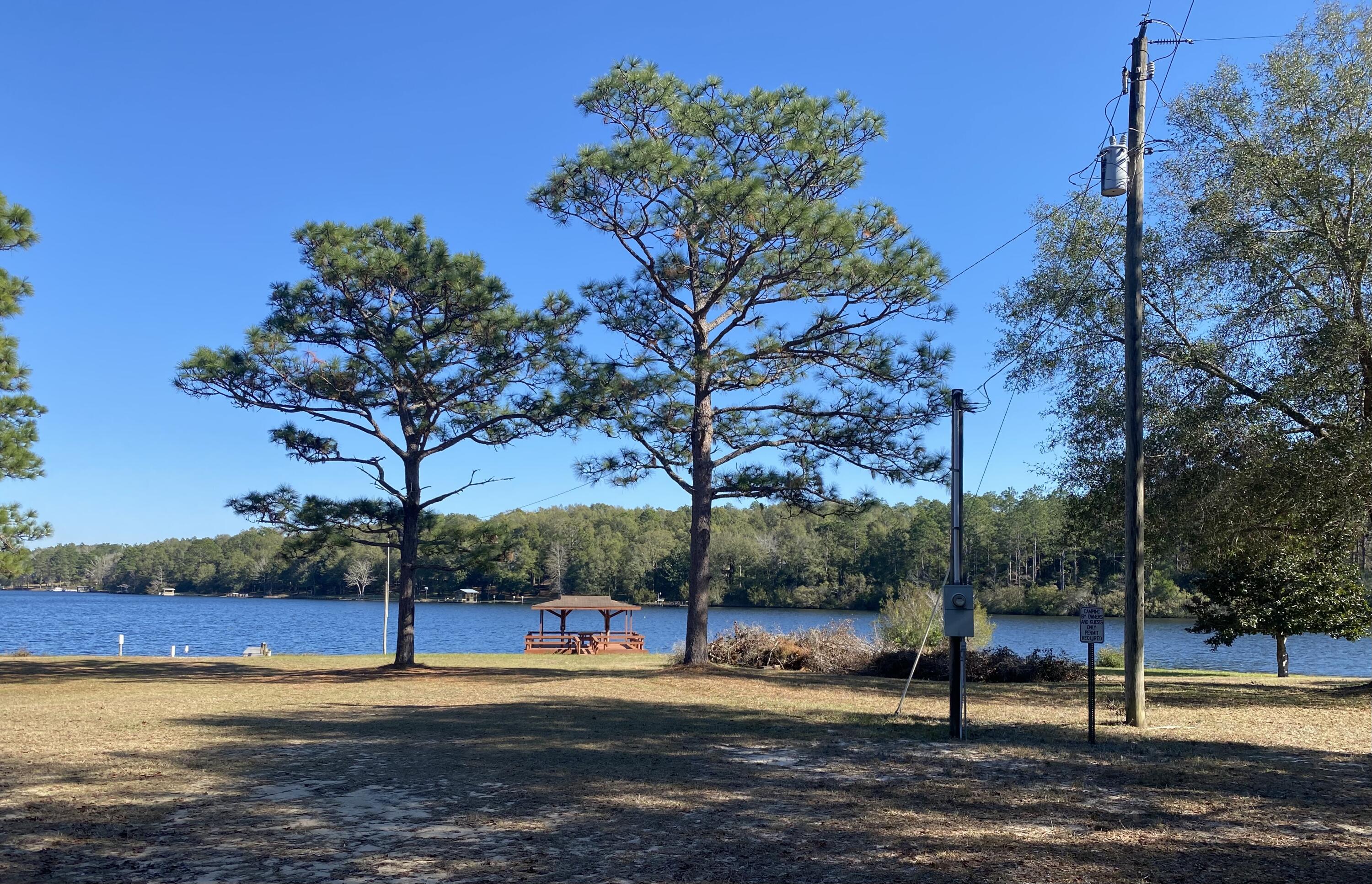 Lot 49 Spring Lake Road, Unit Q&R DeFuniak Springs, FL 32433 - Photo 2 of 6 a view of a park with large trees