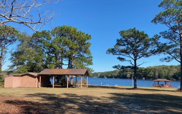 Lot 49 Spring Lake Road, Unit Q&R DeFuniak Springs, FL 32433 - Photo 4 of 6 a view of a house with pool and trees