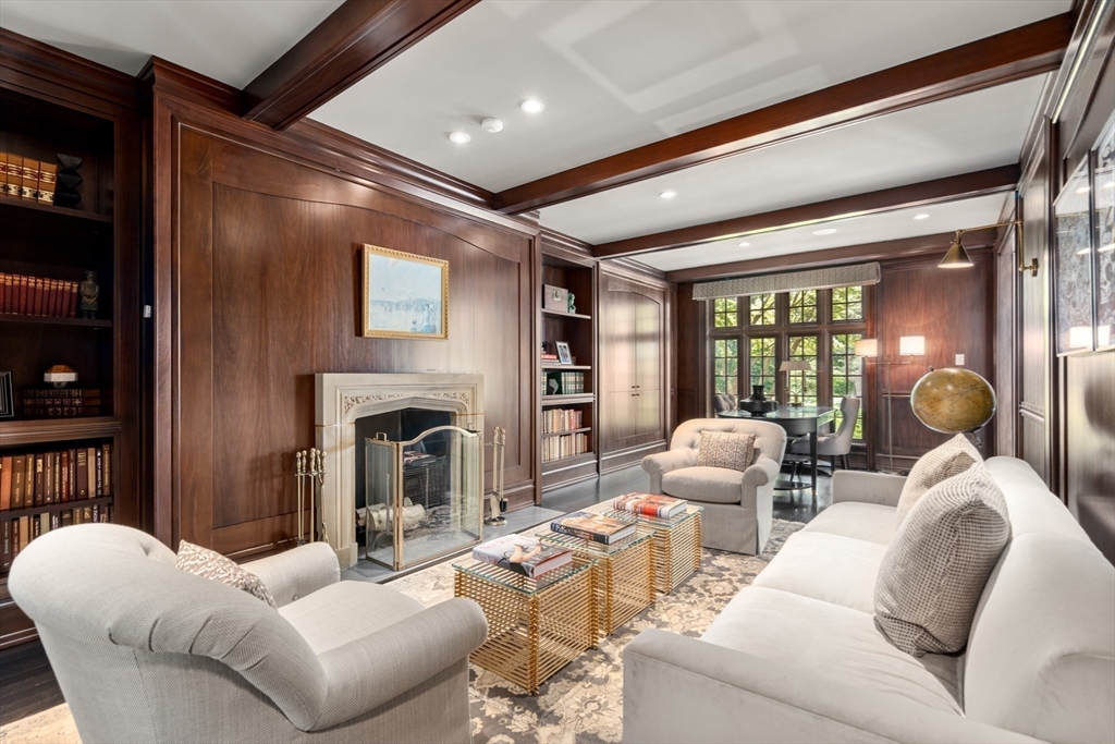 1014 Boylston Street Brookline, MA 02467 - Photo 11 of 38 a living room with furniture a fireplace and a large window