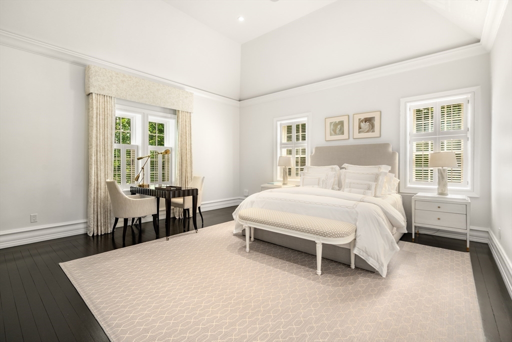 1014 Boylston Street Brookline, MA 02467 - Photo 20 of 38 a bedroom with a bed table and a window