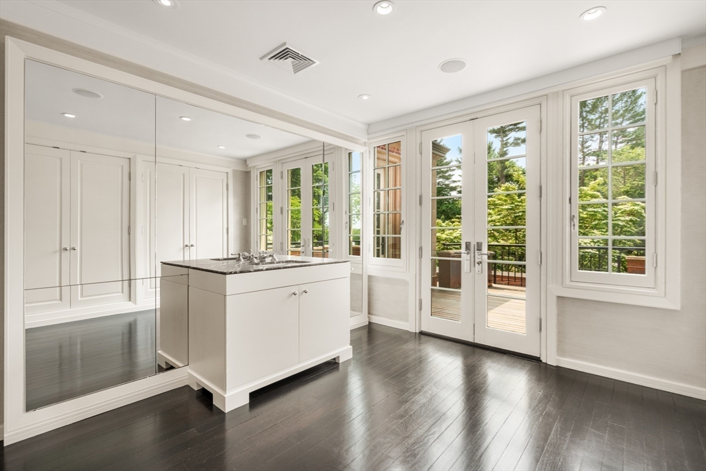 1014 Boylston Street Brookline, MA 02467 - Photo 21 of 38 a large white room with window and wooden floor