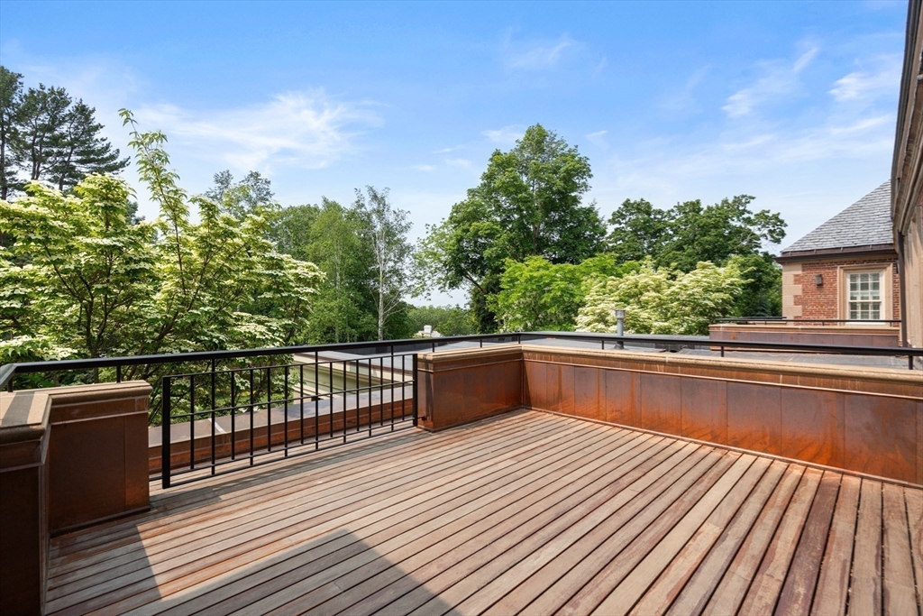 1014 Boylston Street Brookline, MA 02467 - Photo 22 of 38 a view of balcony with wooden floor and fence