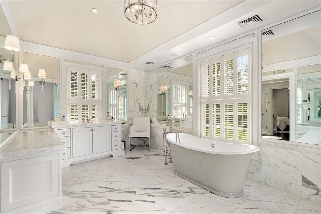 1014 Boylston Street Brookline, MA 02467 - Photo 23 of 38 a large spacious bathroom with a large tub shower and sink