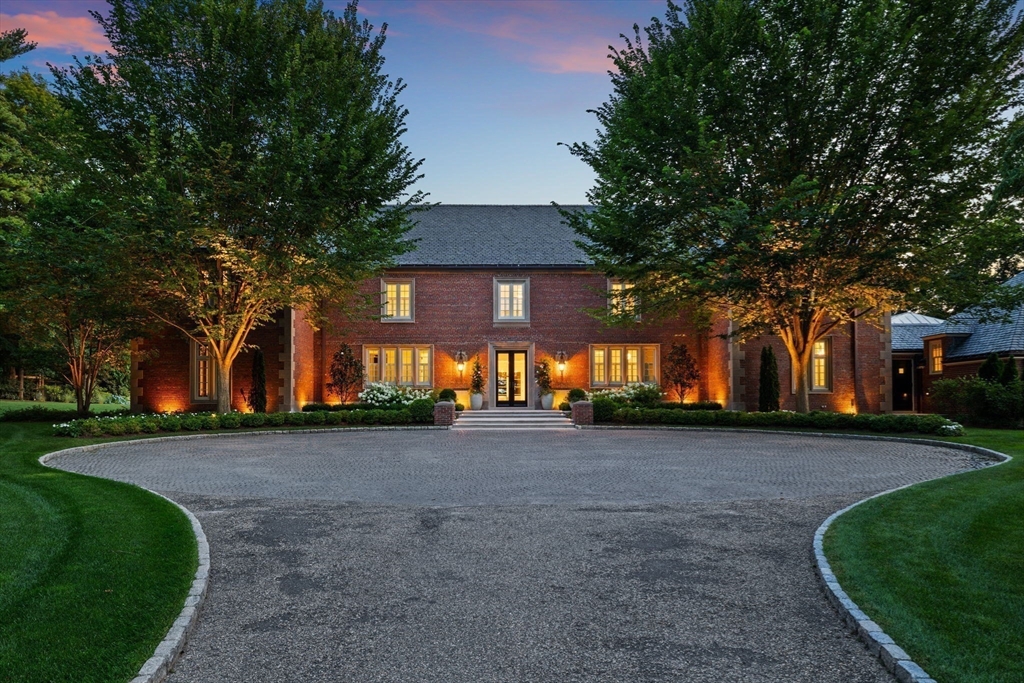 1014 Boylston Street Brookline, MA 02467 - Photo 3 of 38 a front view of a house with a yard and tree s