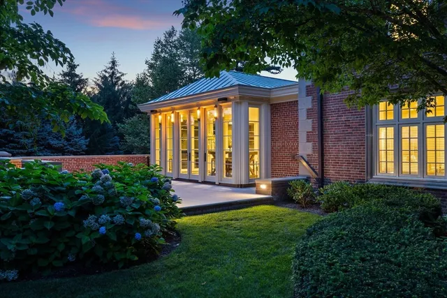 a view of house with backyard and garden
