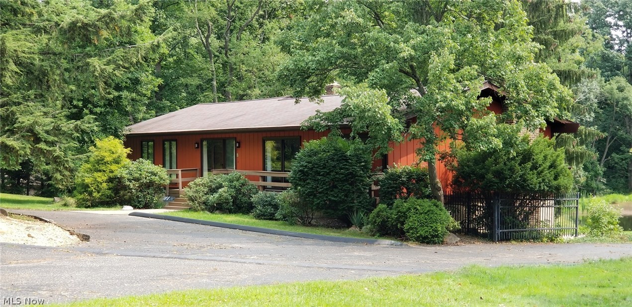 1261 Sand Run Road Akron, OH 44313 - Photo 1 of 32 Wonderful ranch, complete with a fully finished walk-out lower level, nestled in the woods, overlooking your private pond.