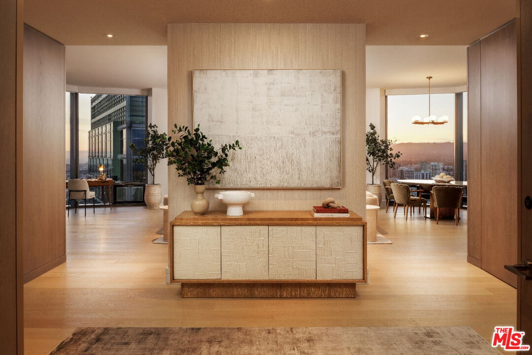 211 Elm Court, Unit 39B Los Angeles, CA 90067 - Photo 2 of 29 a view of a hallway with a couch and mirror